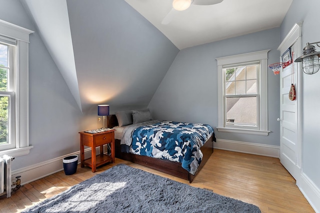 5224 17th Ave S, Minneapolis, MN 55417 - bedroom with vaulted ceiling, hardwood / wood-style floors, a ceiling fan, and radiator