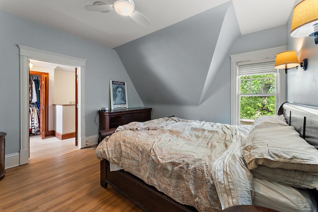 5224 17th Ave S, Minneapolis, MN 55417 - bedroom featuring wood finished floors, lofted ceiling, a ceiling fan, and a spacious closet