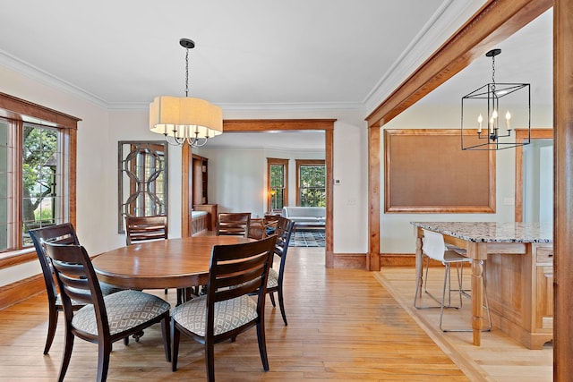 5224 17th Ave S, Minneapolis, MN 55417 - dining room with a chandelier, light wood-type flooring, plenty of natural light, and ornamental molding