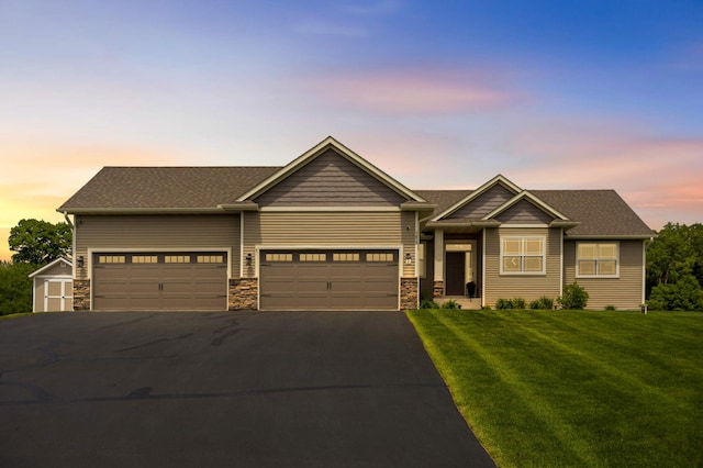 3839 189th Ln NW, Oak Grove, MN 55303 - craftsman inspired home featuring asphalt driveway, a front yard, an attached garage, stone siding, and a shingled roof