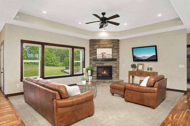 3839 189th Ln NW, Oak Grove, MN 55303 - living area with light wood-type flooring, a ceiling fan, a raised ceiling, baseboards, and recessed lighting