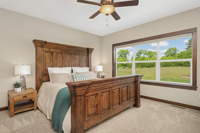 3839 189th Ln NW, Oak Grove, MN 55303 - bedroom featuring baseboards, light colored carpet, and a ceiling fan