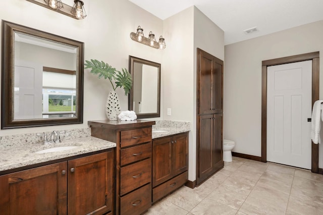 3839 189th Ln NW, Oak Grove, MN 55303 - bathroom featuring double vanity and toilet