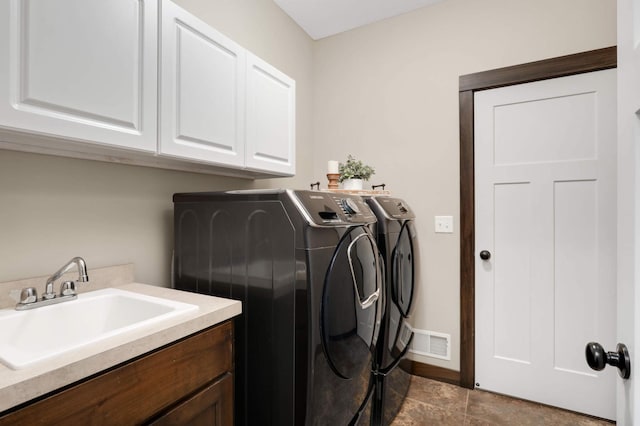 3839 189th Ln NW, Oak Grove, MN 55303 - washroom featuring washing machine and clothes dryer, cabinet space, tile patterned floors, and baseboards