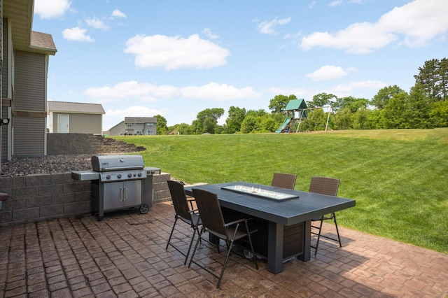 3839 189th Ln NW, Oak Grove, MN 55303 - view of patio / terrace featuring a playground, outdoor dining area, area for grilling, and an outdoor fire pit