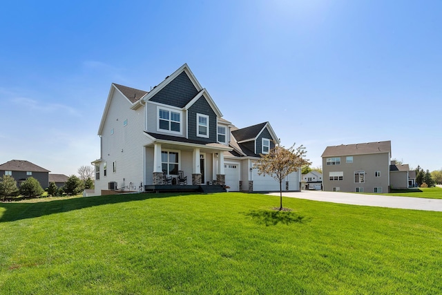 craftsman-style house with concrete driveway, a front yard, and covered porch