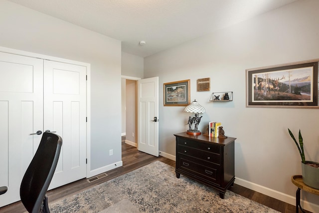home office featuring wood finished floors and baseboards