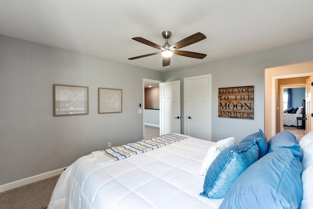 bedroom with carpet, baseboards, and a ceiling fan