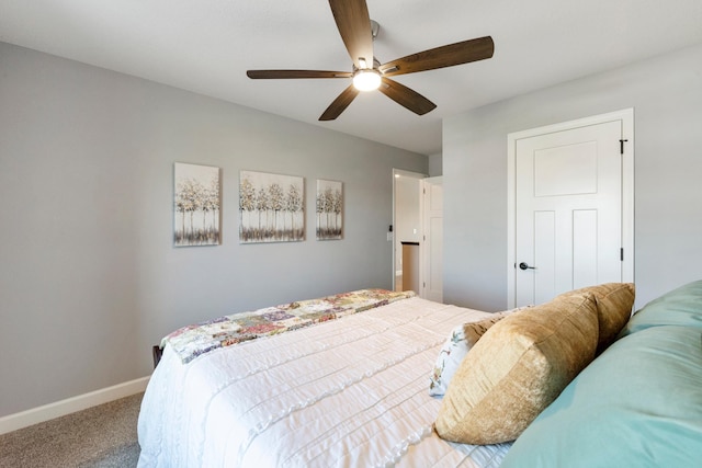carpeted bedroom with baseboards and a ceiling fan