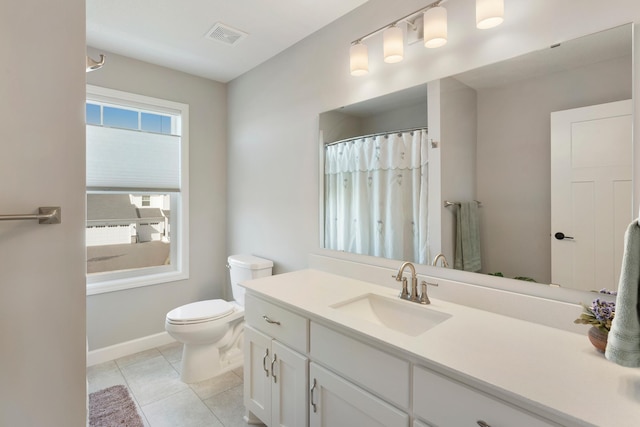 full bath with toilet, tile patterned flooring, vanity, and baseboards
