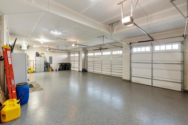 garage featuring a garage door opener and electric panel