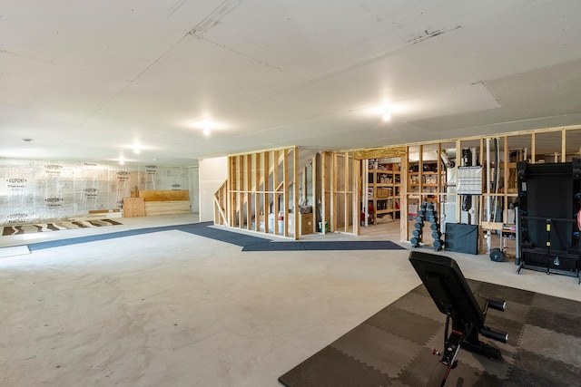 unfinished below grade area featuring stairway