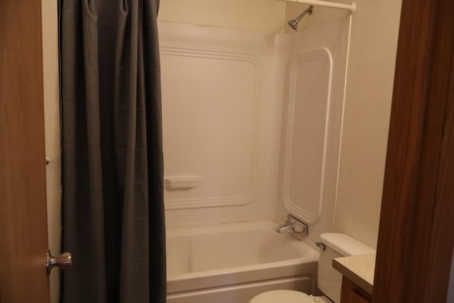 bathroom with vanity, toilet, and shower / bath combo