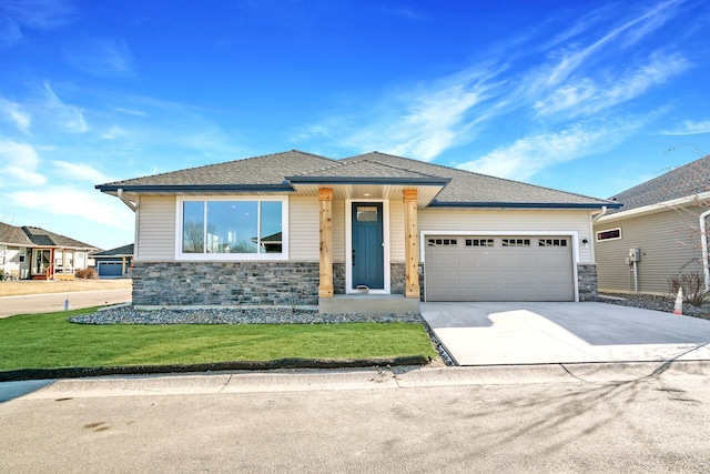 1234 Willowbrook Cir, Delano, MN 55328 - prairie-style home featuring stone siding, an attached garage, a front yard, and concrete driveway