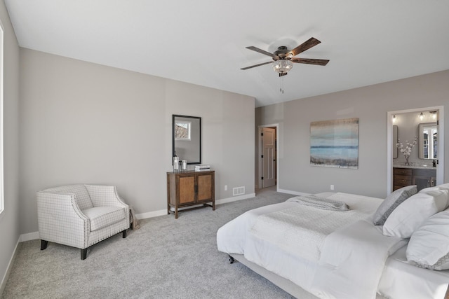 1234 Willowbrook Cir, Delano, MN 55328 - bedroom with visible vents, connected bathroom, carpet floors, baseboards, and ceiling fan