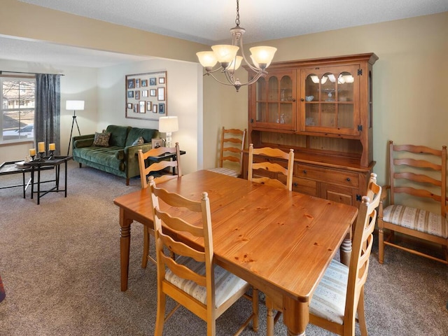 2052 Wilhelm Ct, Shakopee, MN 55379 - carpeted dining room with a chandelier
