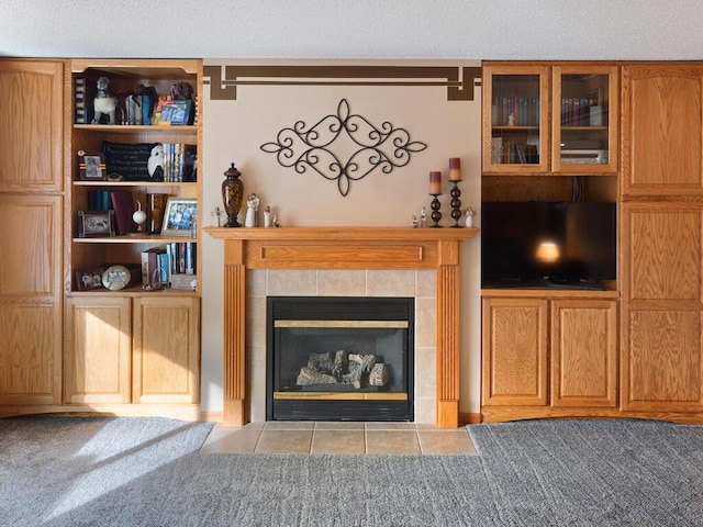 2052 Wilhelm Ct, Shakopee, MN 55379 - living area featuring a tiled fireplace, tile patterned flooring, and a textured ceiling