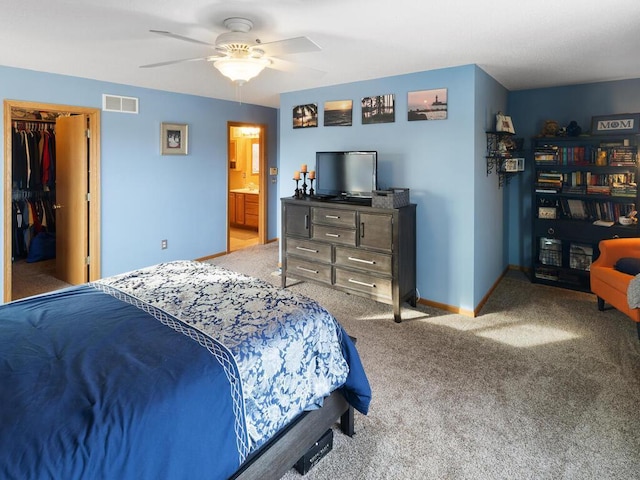 2052 Wilhelm Ct, Shakopee, MN 55379 - carpeted bedroom with baseboards, ceiling fan, and a spacious closet