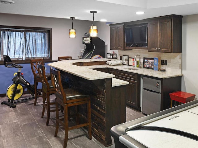2052 Wilhelm Ct, Shakopee, MN 55379 - bar featuring a sink, recessed lighting, fridge, pendant lighting, and decorative backsplash