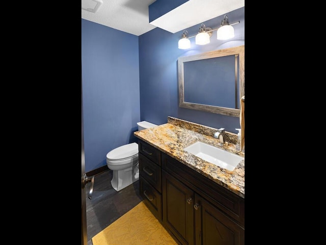 2052 Wilhelm Ct, Shakopee, MN 55379 - bathroom featuring toilet, vanity, and baseboards