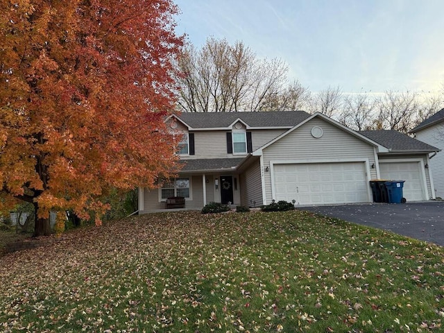 2052 Wilhelm Ct, Shakopee, MN 55379 - traditional-style home with an attached garage, asphalt driveway, a front lawn, and a porch