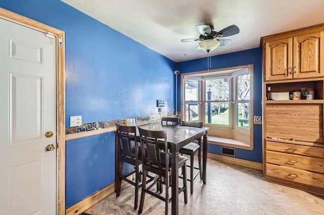dining space with a ceiling fan, baseboards, and visible vents
