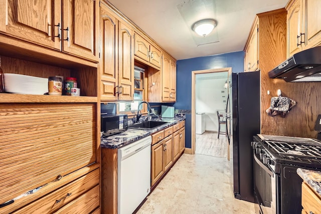 kitchen with a sink, black appliances, and under cabinet range hood