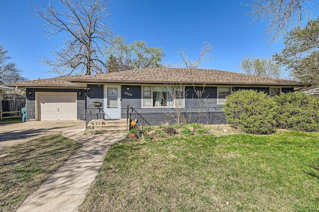 ranch-style house featuring driveway, a front yard, and a garage