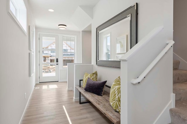 interior space featuring light wood finished floors and baseboards