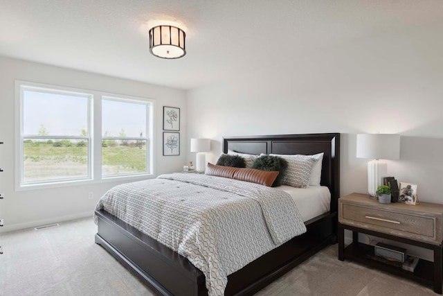 bedroom featuring baseboards and carpet floors