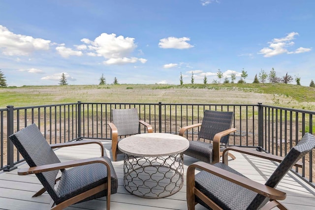 wooden terrace featuring a rural view