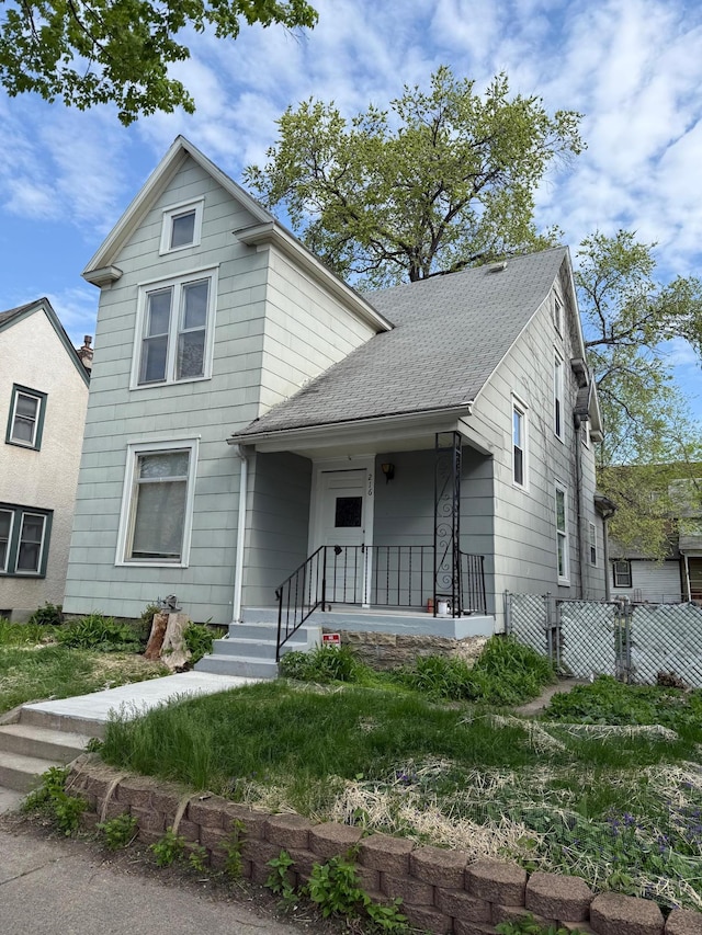 view of front of property with roof with shingles