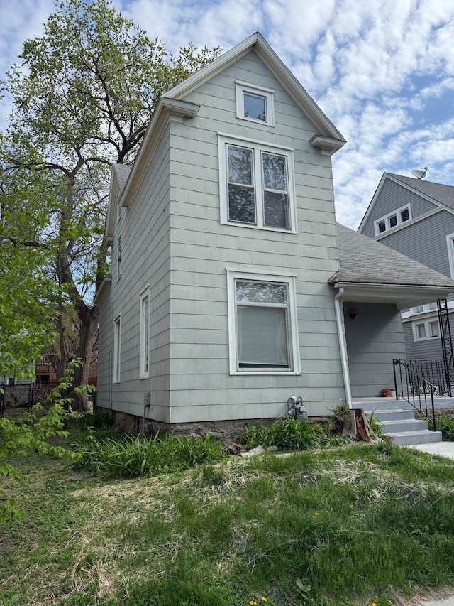 view of front of home featuring a shingled roof