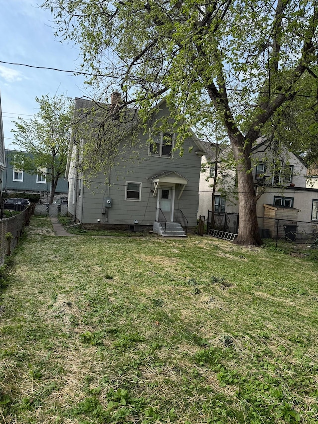 back of property featuring a chimney