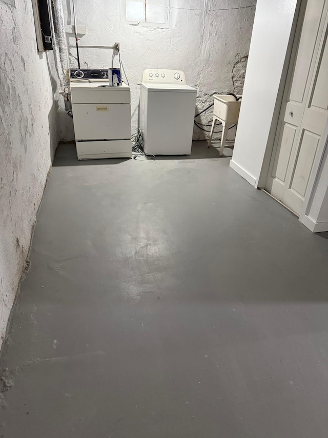 unfinished below grade area featuring washer and dryer