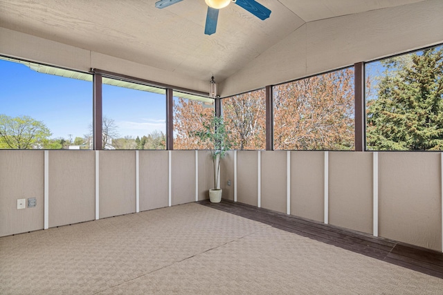 unfurnished sunroom featuring lofted ceiling