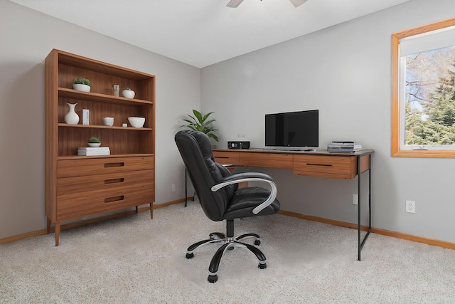 home office with light colored carpet, baseboards, and ceiling fan