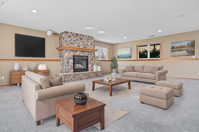 living area with carpet floors, baseboards, a fireplace, and recessed lighting