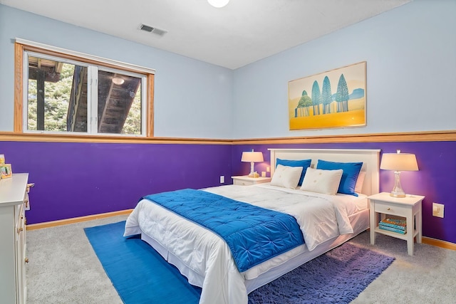 carpeted bedroom featuring baseboards