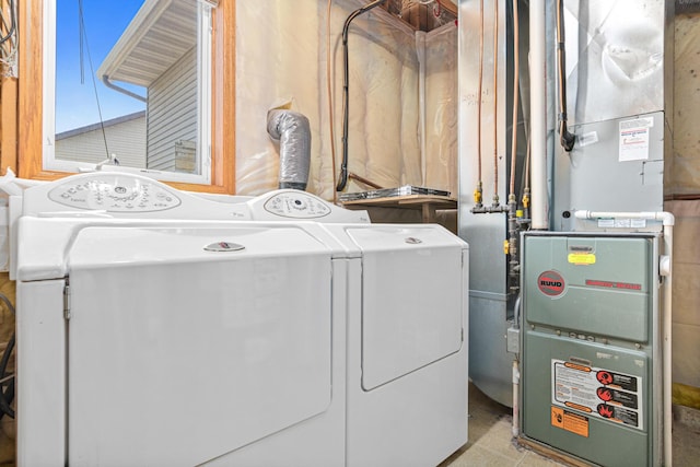 washroom featuring washer and dryer and heating unit