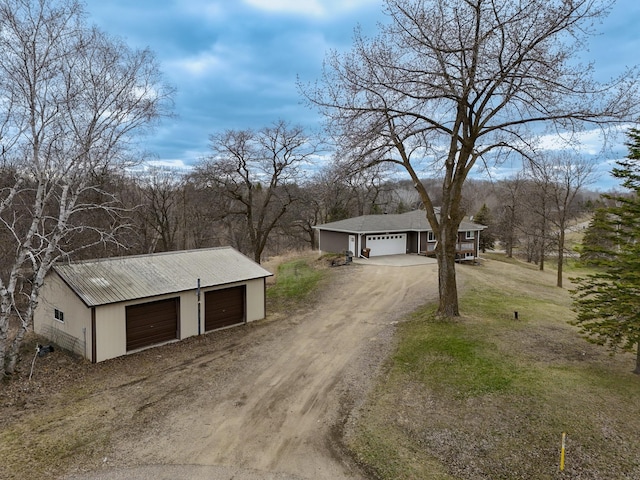 view of street featuring dirt driveway