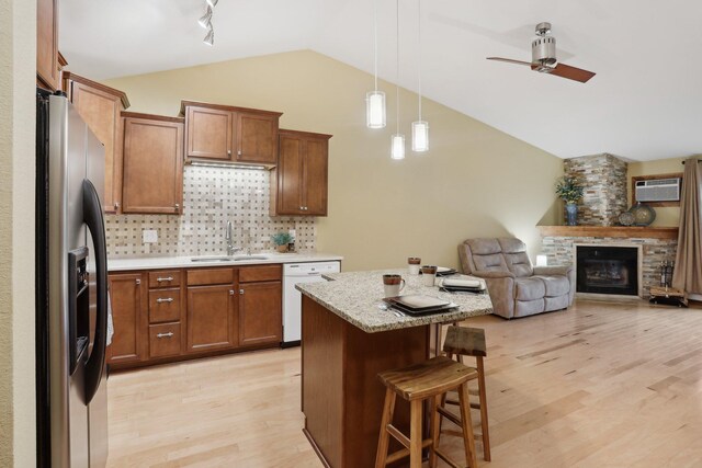 3850 Plymouth Blvd Unit 318, Plymouth, MN 55446 - kitchen with lofted ceiling, white dishwasher, a kitchen breakfast bar, stainless steel fridge, and a sink