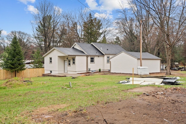back of property featuring stucco siding