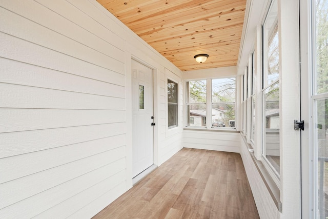 unfurnished sunroom featuring healthy amount of natural light