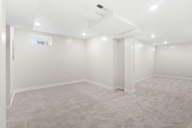 basement with light colored carpet, recessed lighting, and baseboards
