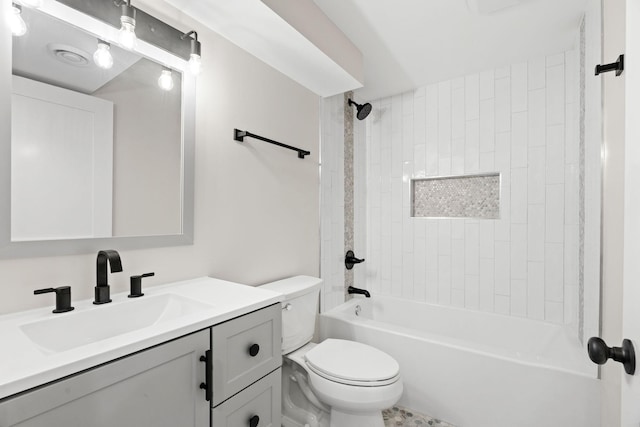 bathroom with toilet, vanity, and  shower combination