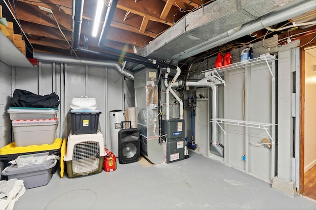 unfinished basement featuring heating unit
