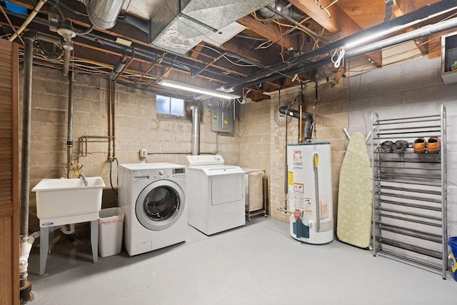 clothes washing area with laundry area, electric panel, independent washer and dryer, a sink, and water heater