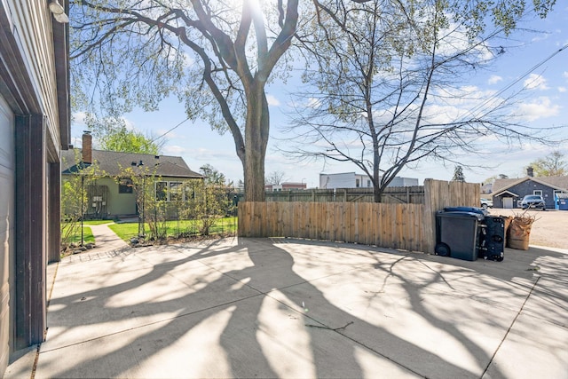view of patio featuring fence