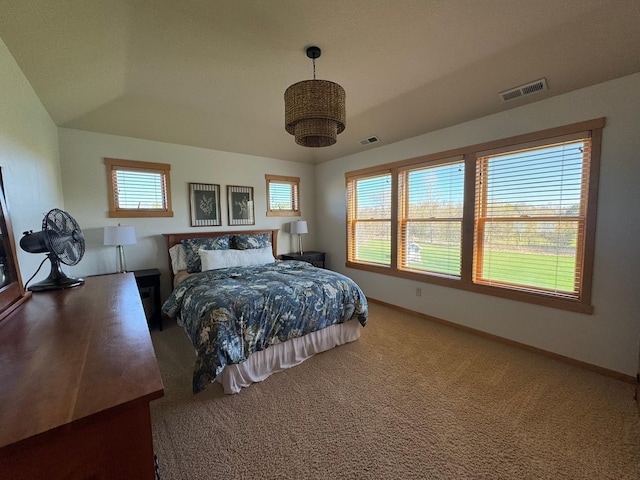 carpeted bedroom with baseboards and visible vents